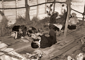 Fishrmen’s Wives Sit Down in American Gun Range [Yoshiichi Nagata,  from Asahi Shimbun News Photography 1954] Thumbnail Images