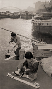 Children Who Lives on the Water (A Child Playing with the Toy Train) [Yukichi Watanabe,  from ARS CAMERA December 1954] Thumbnail Images